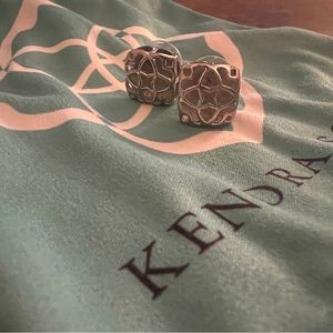 Kendra Scott silver stud earrings.